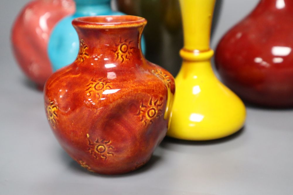 A collection of Burmantofts faience pottery vases, H 9cm to 23cm